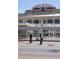 Close-up of Union Station with people walking nearby on a sunny day at 1750 Wewatta St # 809, Denver, CO 80202