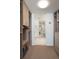 Spacious walk-in closet featuring custom shelving, drawers, and a view into the connected bathroom at 1750 Wewatta St # 809, Denver, CO 80202
