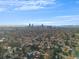 Aerial view showcases cityscape and surrounding neighborhood, offering a glimpse of urban living at 2207 E 25Th, Denver, CO 80205