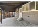 Covered patio with concrete flooring, access to the house and fenced yard at 2207 E 25Th, Denver, CO 80205