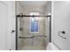 Bathroom with glass shower and marble-look tile at 2207 E 25Th, Denver, CO 80205