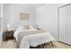 Well-lit bedroom showcases a queen bed, bedside tables, and minimalist decor at 2207 E 25Th, Denver, CO 80205