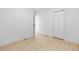 Bright bedroom features hardwood floors, closet and an open doorway at 2207 E 25Th, Denver, CO 80205