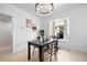 Open dining area features modern lighting, dining table, and comfortable seating at 2207 E 25Th, Denver, CO 80205