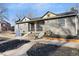 Updated bungalow exterior, fresh gray paint, and landscaping at 2207 E 25Th, Denver, CO 80205