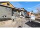 Newly renovated home with gray exterior and rock accents at 2207 E 25Th, Denver, CO 80205