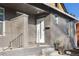 Modern front entrance with gray stucco and a white door at 2207 E 25Th, Denver, CO 80205