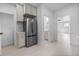 The modern kitchen with stainless steel appliances and easy access to the bathroom at 2207 E 25Th, Denver, CO 80205