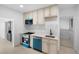 Updated kitchen featuring teal accents and new appliances at 2207 E 25Th, Denver, CO 80205