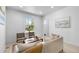 Bright living room offering natural light, seating, and stylish decor at 2207 E 25Th, Denver, CO 80205