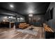 Finished basement with a modern bar area, cozy seating, and entertainment center for Gathering and friends to enjoy at 5795 S Pagosa Way, Centennial, CO 80015