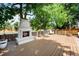 Inviting outdoor fireplace on a wood deck, perfect for relaxing evenings at 5795 S Pagosa Way, Centennial, CO 80015