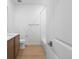 Modern bathroom featuring white quartz countertops, toilet and shower at 6153 N Ceylon St # 307, Denver, CO 80249