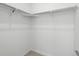 Empty white walk-in closet with a rod and shelf for maximum storage at 6153 N Ceylon St # 307, Denver, CO 80249