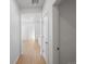 Bright hallway leading into a modern home with light hardwood floors at 6153 N Ceylon St # 307, Denver, CO 80249