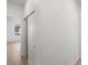 Hallway of home featuring modern light wood flooring and white walls at 6153 N Ceylon St # 307, Denver, CO 80249