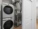 Convenient laundry area with modern Samsung washer and dryer and storage space at 6153 N Ceylon St # 307, Denver, CO 80249
