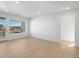 Bright living room with contemporary light-colored hardwood floors and lots of natural light at 6153 N Ceylon St # 307, Denver, CO 80249