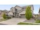 Lovely two-story home with a three car garage and a well manicured front lawn at 16227 Pikes Peak Dr, Broomfield, CO 80023