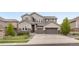 Beautiful two-story home with a three car garage and stone and siding facade at 16227 Pikes Peak Dr, Broomfield, CO 80023