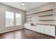 Home office with custom built-ins, wood countertops and shelving, and natural light at 16227 Pikes Peak Dr, Broomfield, CO 80023