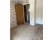 Bedroom with patterned wallpaper and a view into the hall and other rooms at 9062 Utica St, Westminster, CO 80031