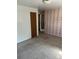 Bedroom featuring neutral carpet and pink patterned wallpaper, ready for transformation at 9062 Utica St, Westminster, CO 80031