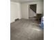 Cozy living room with plush carpeting and staircase at 9062 Utica St, Westminster, CO 80031
