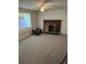 Cozy living room featuring neutral carpet and a brick fireplace, ready for personalization at 9062 Utica St, Westminster, CO 80031