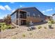 Home exterior with a spacious backyard and landscaping, offering great potential for outdoor activities at 10723 N Montane Dr, Broomfield, CO 80021