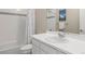 Bathroom with white tiled walls, a tub and shower combination, and a white vanity at 10723 N Montane Dr, Broomfield, CO 80021