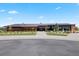Exterior of the community clubhouse with well-manicured landscaping, offering a welcoming space for residents at 10723 N Montane Dr, Broomfield, CO 80021