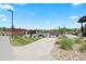 Community pool area with lounge chairs, umbrellas, and well maintained landscaping, offering relaxation at 10723 N Montane Dr, Broomfield, CO 80021