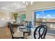 Bright dining area with an elegant glass table and scenic views of the community at 10723 N Montane Dr, Broomfield, CO 80021