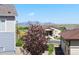Overhead view of homes in a peaceful neighborhood with beautiful mountain views and lush landscaping at 10723 N Montane Dr, Broomfield, CO 80021