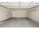Spacious, unfinished two-car garage with a concrete floor and white walls at 10723 N Montane Dr, Broomfield, CO 80021