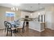 Kitchen featuring an island with a marble countertop, stainless steel appliances, and pendant lighting at 10723 N Montane Dr, Broomfield, CO 80021