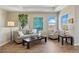 Comfortable living room area featuring hardwood floors, and plentiful natural light at 10723 N Montane Dr, Broomfield, CO 80021