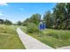 Scenic view of a walking path leading to Skyestone Pond, featuring lush greenery for outdoor enjoyment at 10723 N Montane Dr, Broomfield, CO 80021