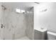 Updated bathroom features a tiled shower with a window and modern vanity at 1148 N Clinton St, Aurora, CO 80010