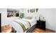 Cozy bedroom featuring hardwood floors and ample natural light at 1148 N Clinton St, Aurora, CO 80010