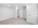 Large finished room featuring carpet flooring and two closets at 1148 N Clinton St, Aurora, CO 80010