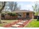 Charming brick home with a well-maintained front yard and inviting entryway at 1148 N Clinton St, Aurora, CO 80010
