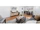 Open concept living space featuring modern decor and a dining area at 1148 N Clinton St, Aurora, CO 80010