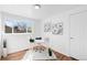 Bright office space featuring hardwood floors and a large window at 1148 N Clinton St, Aurora, CO 80010