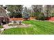 Expansive backyard with well-maintained lawn and patio, offering ample space for outdoor activities and gatherings at 3850 S Willow Way, Denver, CO 80237