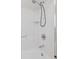 All-white shower with a handheld shower head and chrome fixtures inside of a white-tiled shower at 3850 S Willow Way, Denver, CO 80237