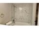 Nicely renovated bathroom with tiled tub and shower combo, for a spa-like experience at 12450 E Cornell Ave # 101, Aurora, CO 80014