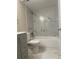 Updated bathroom with modern vanity, toilet, and tiled shower-tub, perfect for relaxation at 12450 E Cornell Ave # 101, Aurora, CO 80014
