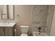 Tastefully updated bathroom with modern fixtures, vanity, and tiled tub-shower combo at 12450 E Cornell Ave # 101, Aurora, CO 80014